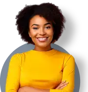 Woman in gloden shirt smiling with arms crossed