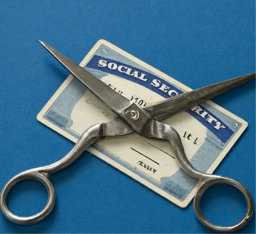 A pair of sissors resting on top of a social security card on blue background